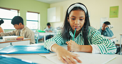 Buy stock photo Classroom, thinking or child with book for learning, development or assessment for maths education. Remember info, contemplating question or girl with pencil for test, answer ideas or problem solving