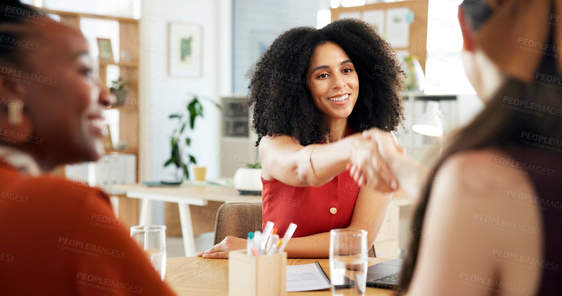 Buy stock photo Office, handshake and business women with smile for promotion, workshop or celebration for feedback. Team, designers and shaking hands with partnership for achievement, meeting or negotiation success