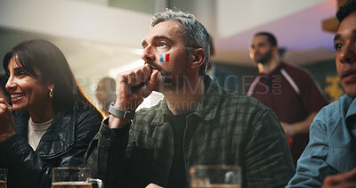 Buy stock photo Sports, watching and man in pub with suspense for score, waiting for goal and live streaming. Face paint, flag and people nervous for team support, match and game for social gathering in restaurant