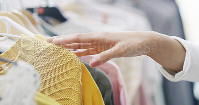 Buy stock photo Hands, person and touch for shopping in store for decision, check quality and fabric texture. Closeup, shopper and choice with clothing rack, outfit option and retail selection of customer experience
