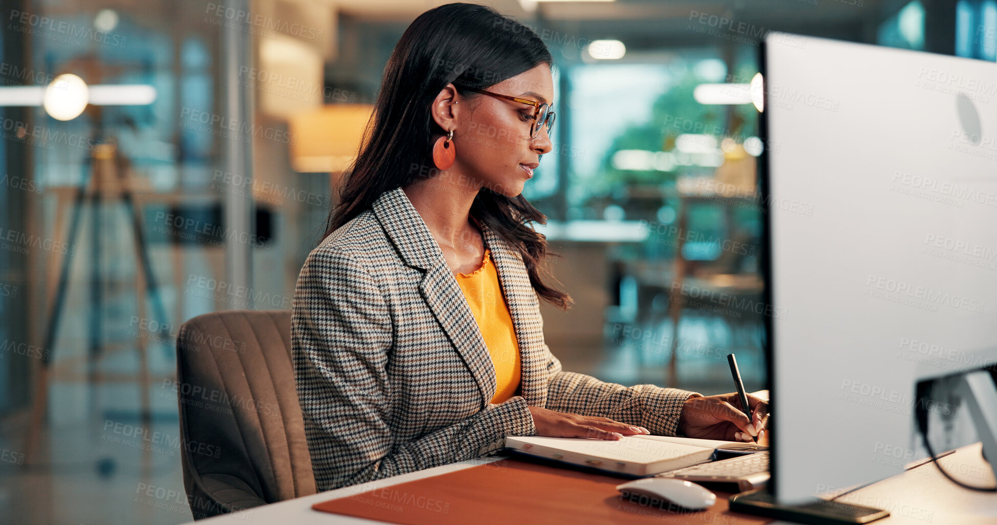 Buy stock photo Notebook, writing and woman with computer in office for creative project and online article. Evening, feedback and magazine editor with agenda, to do list or review for publishing deadline on tech