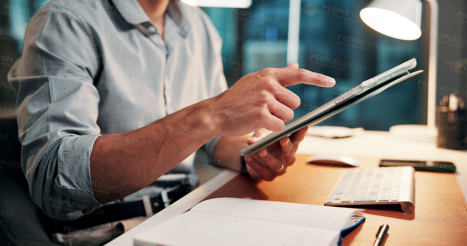 Buy stock photo Typing, online and hands with tablet, office and plan for article on web, creative and working late. Scroll, research and person with tech for story, employee and journalist with deadline at night