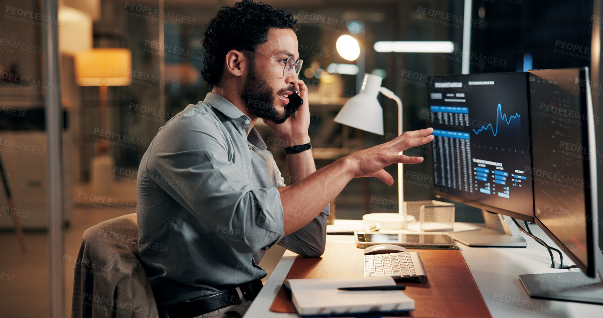 Buy stock photo Man, computer screen and phone call for trading, charts and stock market review at night. Person, smartphone and explain with graphs, talk and consultation with investment portfolio in dark office