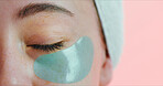Portrait, skincare or eye with patch in studio, reduce dark circles or hydration treatment for wellness. Space, anti aging benefits or woman with mask for dermatology, self care or pink background