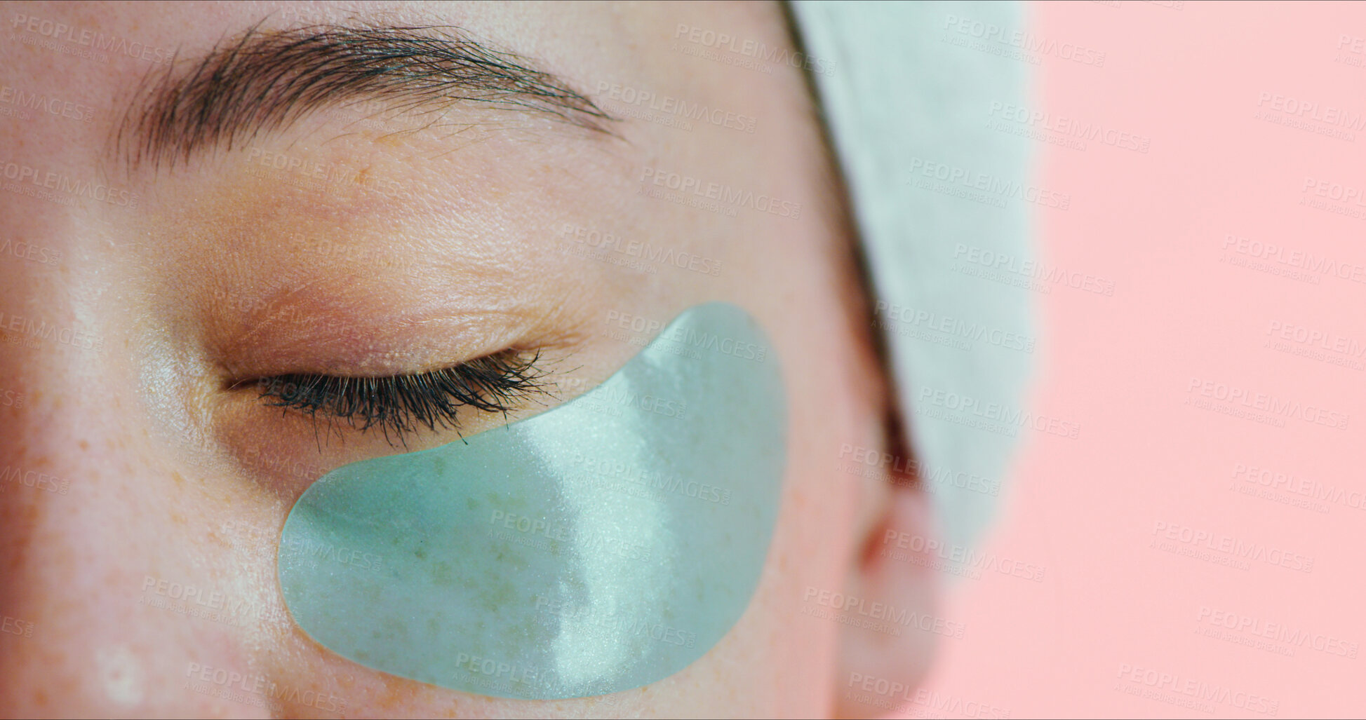 Buy stock photo Beauty, skincare and eye with patch in studio, reduce dark circles and hydration treatment for wellness. Space, anti aging benefits and woman with mask for dermatology, closeup and pink background