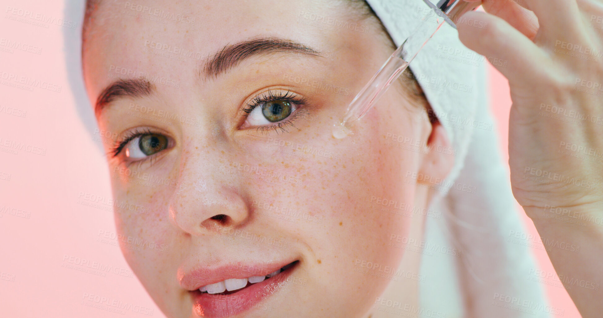 Buy stock photo Beauty, face and girl with serum in studio for hyaluronic acid, hydration and healthy skincare routine. Gen z, person and retinol oil application on pink background for vitamin c treatment and glow