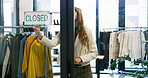 Small business, close and woman with fashion, sign or outfit in designer boutique or thrift store. Entrepreneur, done and retail owner for service, deal or startup with quality fabric at mall