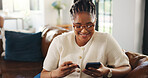 Credit card, smile and black woman on sofa with phone for online shopping, web store sale and purchase. Home, relax and person on tech for internet payment, digital order and ecommerce in living room