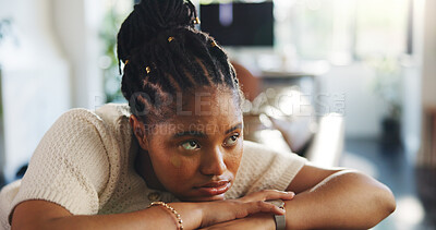 Buy stock photo Thinking, worry and black woman in home with depression, mental health or anxiety in living room. Sad, bored and African female person in apartment with reflection, memory or lonely for breakup.