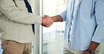 Business people, handshake and meeting with agreement for deal, negotiation or welcome in office. Teamwork, employees or colleagues shaking hands with thank you for b2b or partnership in workplace