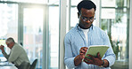 Man, scroll or research in office with tablet for marketing trend, campaign planning or creative idea. Person, coworking or reading with digital tech for advertising project, website or media review.