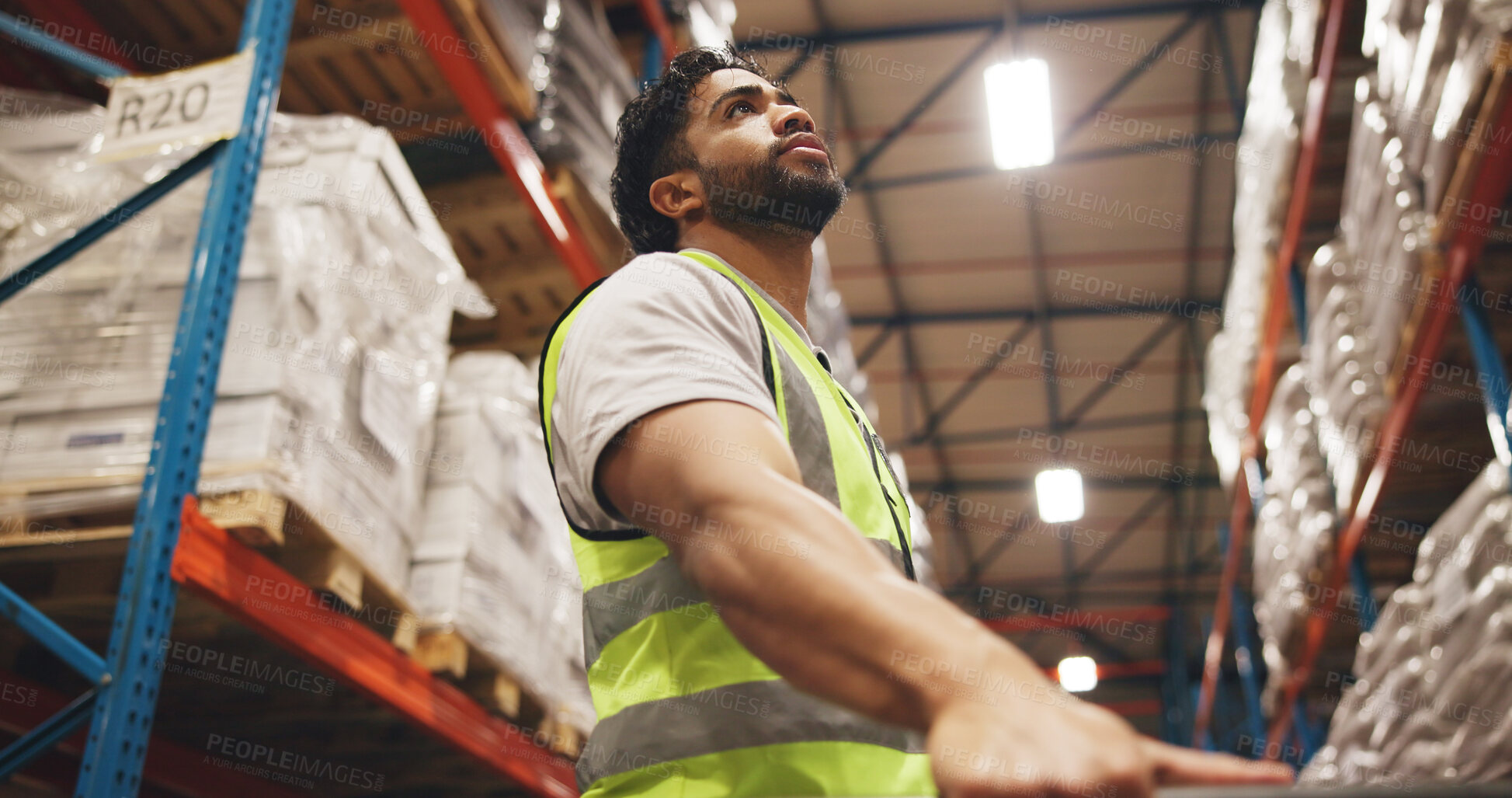Buy stock photo Below, logistics and thinking with man in warehouse aisle for inspection of inventory or stock. Boxes, counting and shelves with person in supply chain depot for delivery, shipping or quality control