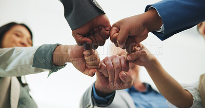 Buy stock photo Fist pump, low angle or team in office with circle, solidarity or motivation in partnership. Support, people or employees in agency with hands together, collaboration or achievement in synergy.