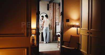 Buy stock photo Back, basin and doorway with man in bathroom of hotel room for hygiene or morning routine. Entrance, start and wake up with guest person at sink of lodge for accommodation, break or hospitality