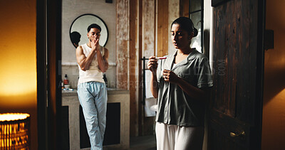 Buy stock photo Shock, pregnancy test and couple in bathroom in home with results on fertility in marriage. Maternity, surprise and man with woman for ovulation kit with family planning together in apartment.