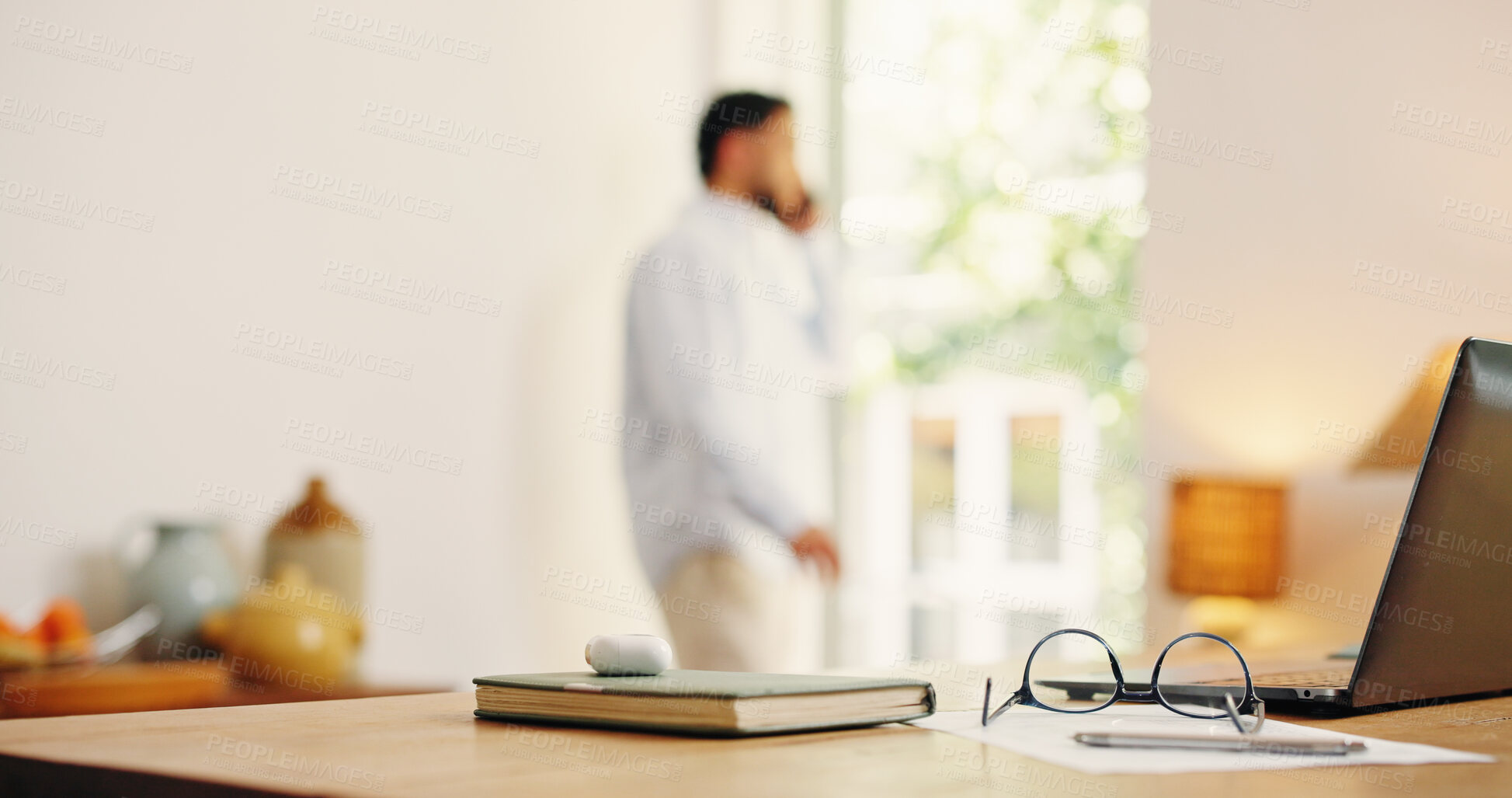 Buy stock photo Man, talking and phone call with laptop at house for consultation, contact source and feedback. Journalist, remote work and glasses with notebook, editing manuscript and fact check for publication