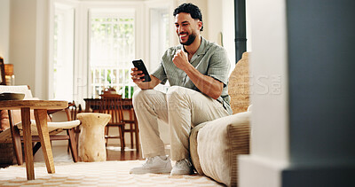 Buy stock photo Happy, man and fist pump with phone in home for online notification, gambling success or achievement. Person, smile and celebration in living room with tech, winning betting competition or good news.