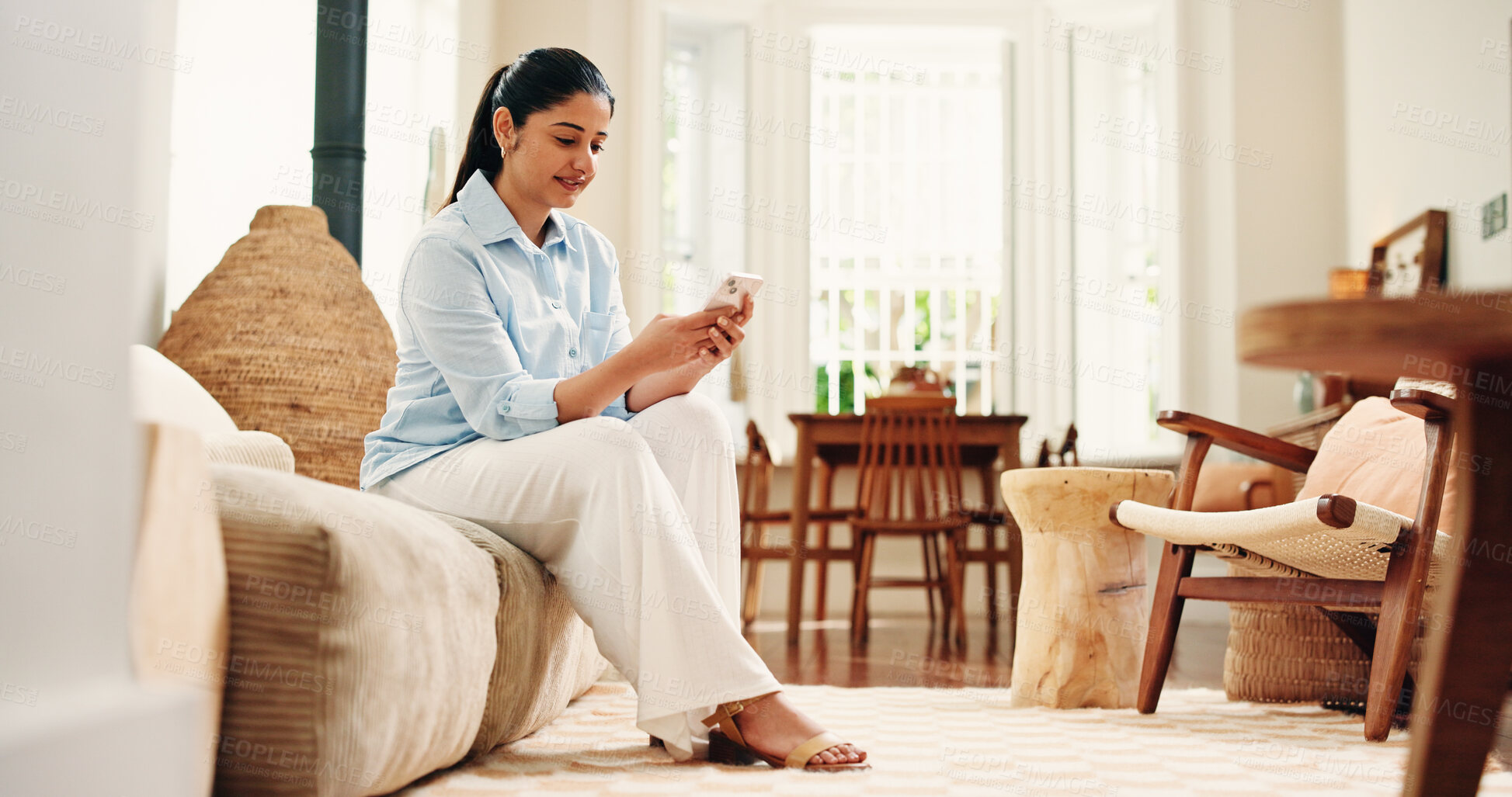 Buy stock photo Sofa, reading and happy woman typing with phone on weekend, social network and check message app for alert. Notification, digital communication and person texting in home, email reply and online chat