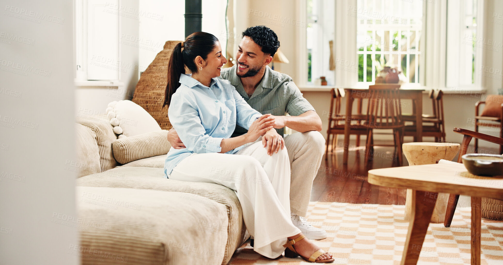 Buy stock photo Happy, sofa and couple in home in conversation for connection, bonding and relax in apartment. Laugh, marriage and man with woman in living room with joke for talking, healthy relationship and love