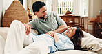Relax, laugh and love with couple on sofa of home for connection, romance and bonding. Support, happy and trust with man and woman in living room of apartment for commitment, marriage and joke