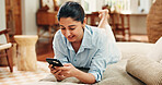 Happy woman, relax and scroll with phone on sofa for social media post, online dating or virtual chat. Person, chill or browse in home with tech for text message notification, internet or mobile app.