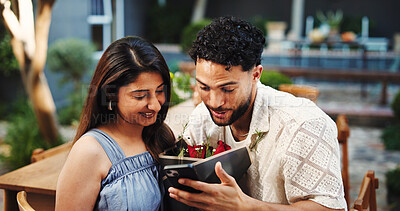 Buy stock photo Love, couple and happy with roses at restaurant for romantic gift, anniversary date and bonding. Celebration, people and smile with flower bouquet for appreciation, healthy relationship or connection