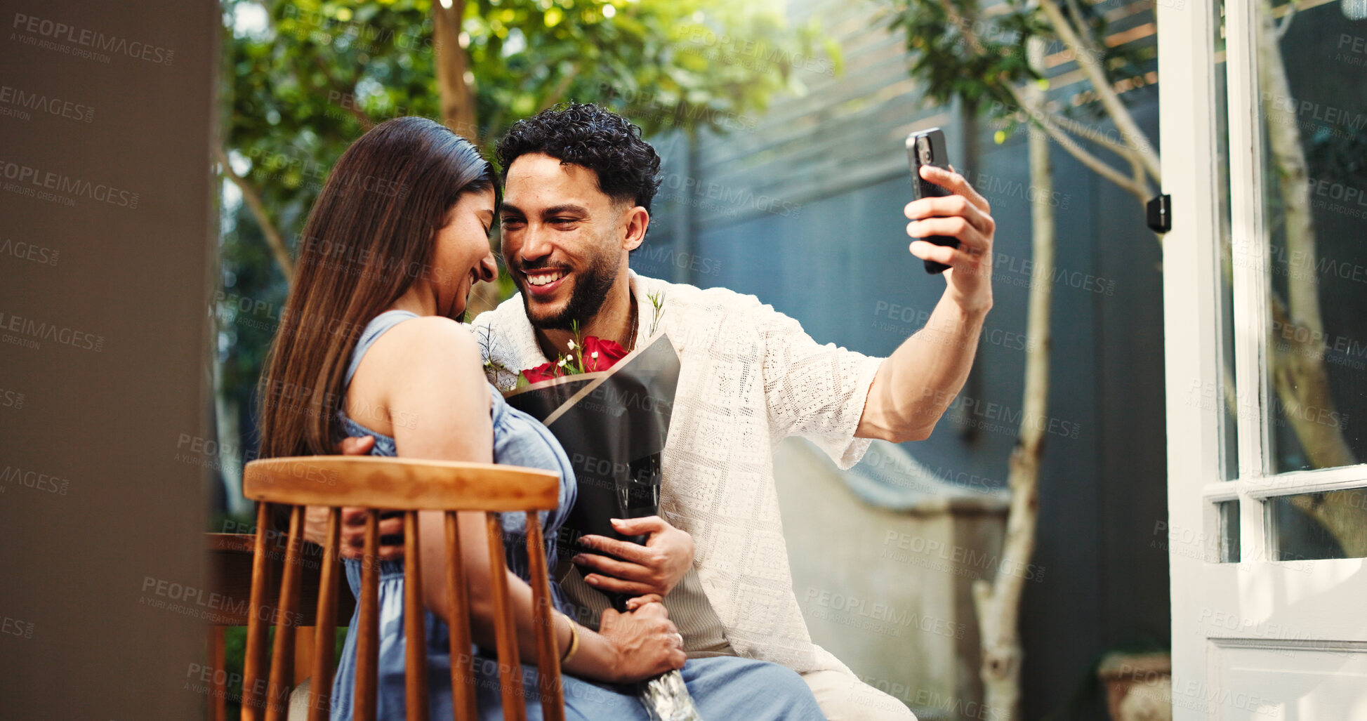 Buy stock photo Happy, couple and selfie with roses, home and celebration of anniversary with post on website or app. Outdoor, man and picture with woman on valet day, excited and memory for social media and online