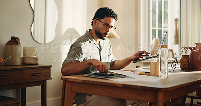 Buy stock photo Creative, paperwork and man with laptop, home and search for logo design on web or freelance project. Graphic designer, online and person with tech for digital art, review and serious for remote work