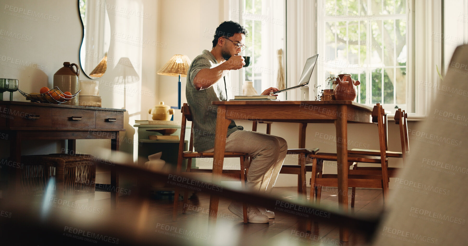 Buy stock photo Creative, coffee and man with laptop, home and research for logo design on web or freelance project. Graphic designer, online and person with tech for digital art, drinking and remote work with tea