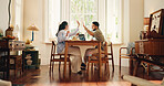 Happy couple, home or laptop with high five for business success or coworking space together. Man, woman or remote work with smile, computer or celebration for winning, good news or teamwork in house