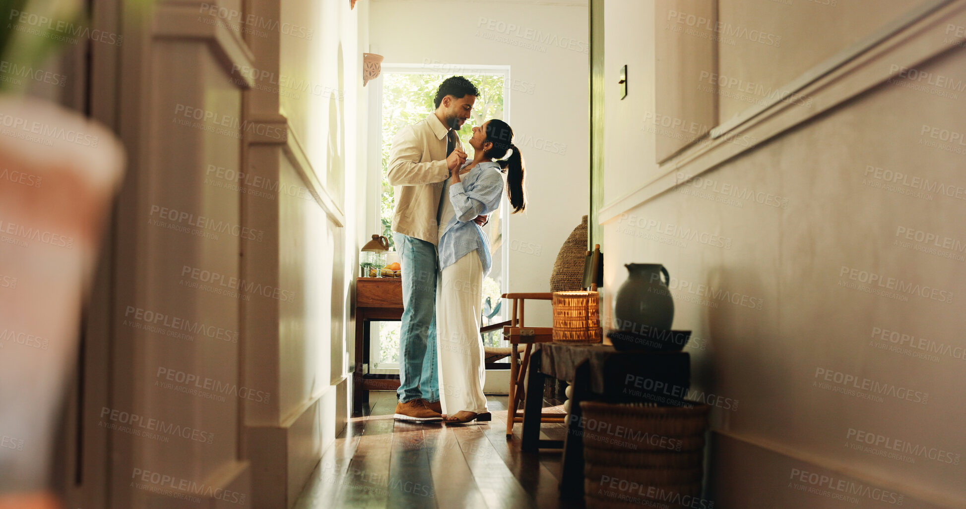 Buy stock photo Smile, couple and dancing with love at house for romance, affection and bonding together with rhythm. People, holding hands and movement for weekend fun, romantic partner and embrace for commitment