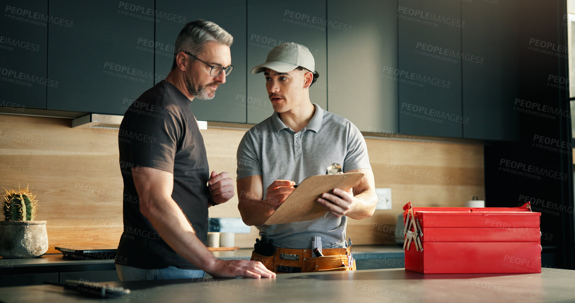 Buy stock photo Plumber, talk and man with clipboard at house for inspection, plumbing evaluation or report. People, toolbox and explain checklist for home maintenance, diagnostic notes and service costs of repairs