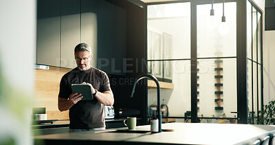 Buy stock photo Mature man, remote work and tablet at house for research, proofreading and article submission. Male person, review and digital for editor feedback, update draft and verify source of story publication