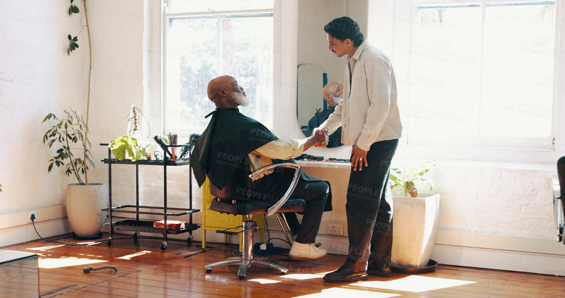 Buy stock photo Consultation, handshake and barber with client in salon for haircut, maintenance or discussion. Appointment, greeting and male hairdresser with customer for trim, hairstyle or shaking hands in parlor