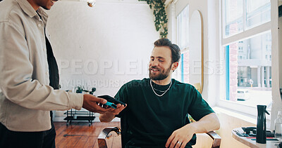 Buy stock photo Happy man, hairdresser or customer with phone for payment, banking app or pos machine in salon. Male people, barber or client with mobile smartphone for tap to pay or wireless transaction in parlor