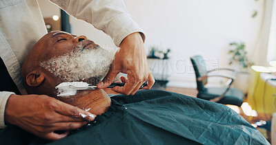 Buy stock photo Shave, barber and man with customer in chair for grooming, haircut and trim for beard service. Hair salon, appointment and people with razor for styling, wellness and hairdresser in barbershop