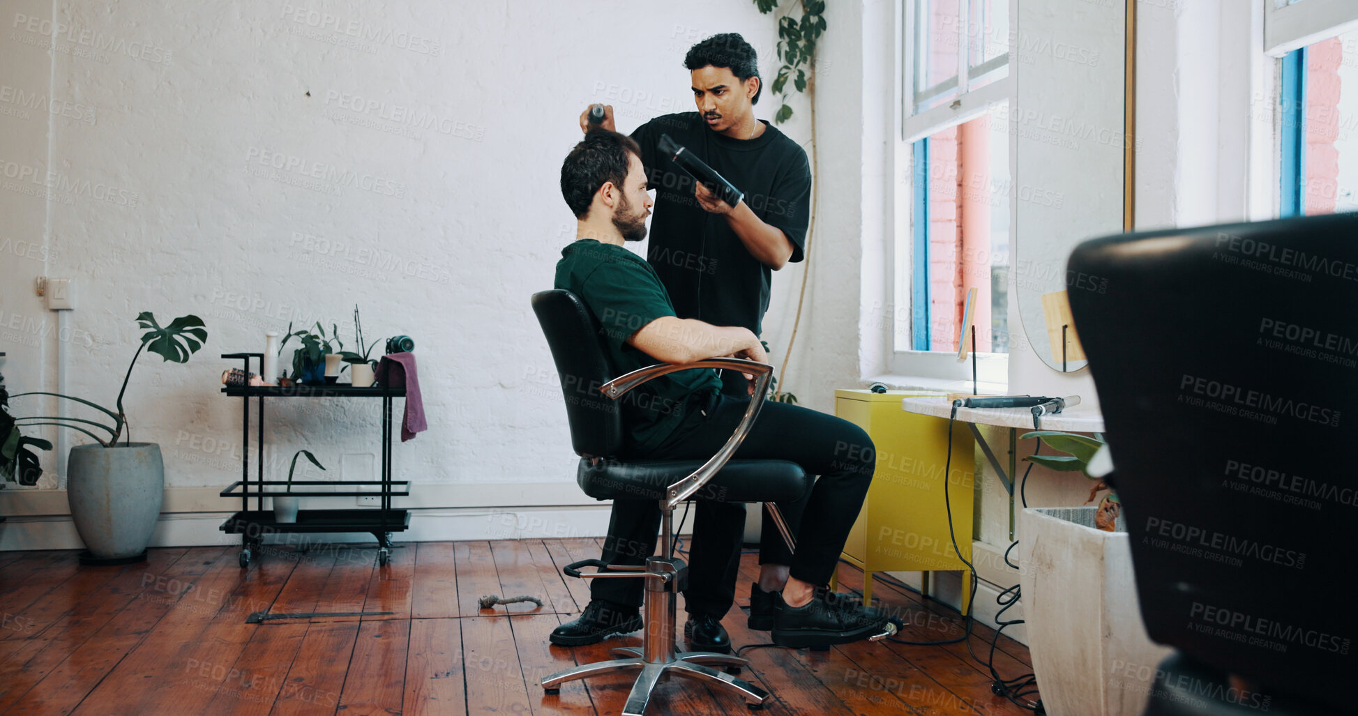 Buy stock photo Appointment, blowdryer and barber with client in salon for haircut, maintenance or discussion. Consultation, people and male hairdresser with customer for trim, hairstyle or self care in parlor.