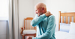 Senior man, bed and shoulder with pain for fibromyalgia, muscle tension or strain in old age home. Elderly, male person or sore neck with pressure for arthritis, tendinitis or joint inflammation