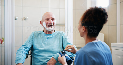 Buy stock photo Senior man, nurse and shaving in bathroom with wheelchair, happy and talk with grooming in home. People, caregiver and elderly person with disability, razor or cream for facial hair removal at house