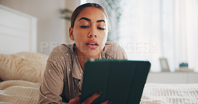 Buy stock photo Tablet, research and reading of woman in bedroom for social media, streaming service and comment update. Connection, online chat forum and post with person and tech in home for communication and app