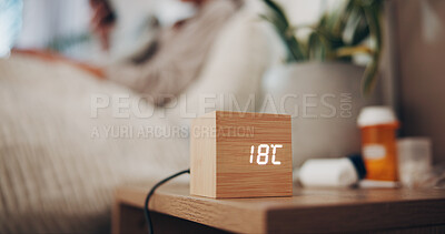 Buy stock photo Digital alarm, temperature and bedroom in home for sleep schedule, person or rest for wellness. Wood clock, monitor and LED display with box, ui or thermostat at night for comfort at apartment