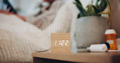 Buy stock photo Digital alarm, clock or bedroom in home for sleeping schedule, person and rest for wellness. Electronics, watch and LED display with time for reminder, ui or pills on pedestal for health at apartment