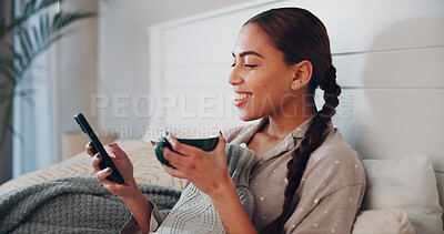Buy stock photo Phone, coffee and smile of woman in bedroom for social media, streaming service and comment update. Connection, online chat forum and post with person and drink in home for communication and app