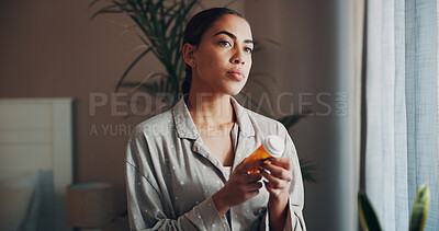Buy stock photo Home, woman and thinking with pills in morning for prescription, health remedy and cure. Apartment, person and contemplating with medication for side effects, pharmaceutical drugs and supplements