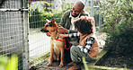 Animal shelter, dad and child with dog outdoor for adoption, foster care and bonding. Kennel, sanctuary and kid with canine for rescue, pet ownership and companion at charity, ngo and volunteer
