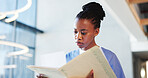 Nurse, woman and reading in hospital with paperwork for patient history, medical diagnosis and folder. Black person, healthcare worker and check file in clinic for test results, report and document.