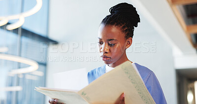 Buy stock photo Nurse, woman and reading in hospital with paperwork for patient history, medical diagnosis and folder. Black person, healthcare worker and check file in clinic for test results, report and document.