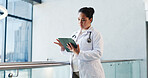 Tablet, doctor and woman in hospital for research, healthcare or reading report with information. Tech, medical professional or serious person with history for telehealth, clinic records or insurance