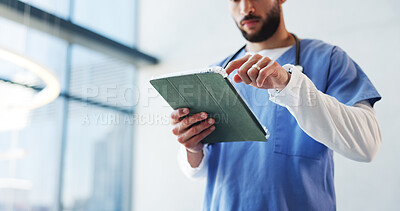 Buy stock photo Hospital, surgeon and below of man on tablet in lobby for patient results, medical report and research. Healthcare, doctor and person on digital tech for website, surgery schedule or help in clinic