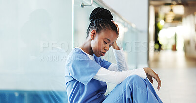 Buy stock photo Nurse, woman and stress on clinic floor for healthcare fatigue, medical mistake or patient loss. Professional, black person or overwhelmed in hospital hallway for surgery fail, mental health or space